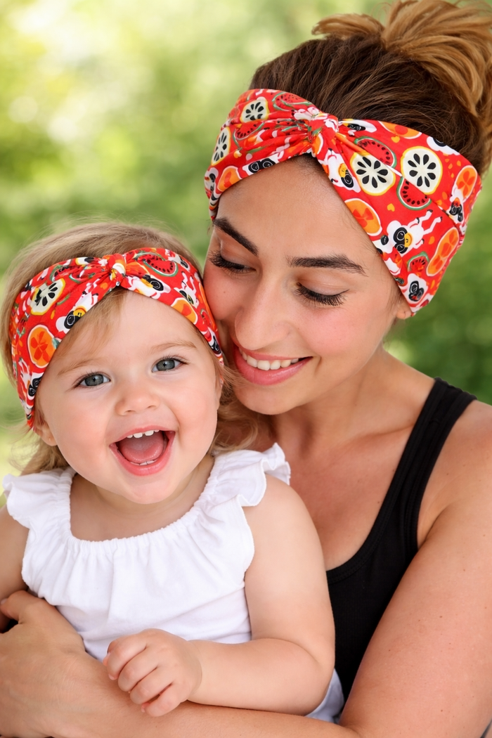 Fruity lemur print soft stretch fabric mom and toddler headbands close up matching set