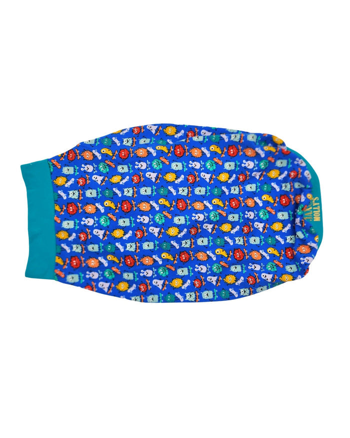 Back view of Jax & Molly's dog pajamas featuring an adorable print of colorful monster on skateboards complimented by a jade colored trim.