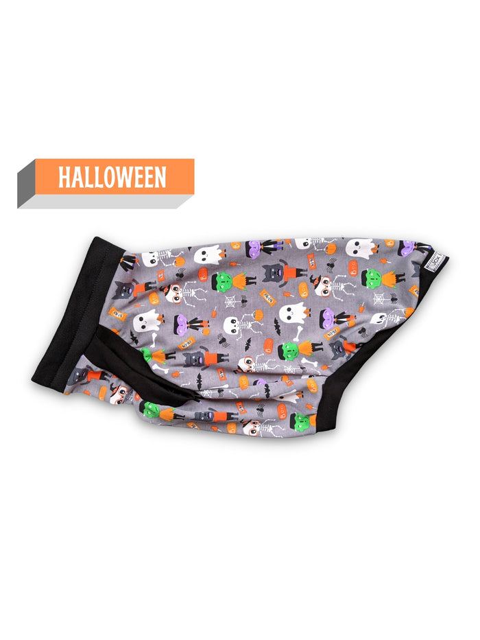 Side view of the monster squad Halloween Dog Muscle Tank by Jax & Molly's, featuring a playful print of iconic monsters like Dracula and Frankensteins accented with black trim on a white background.