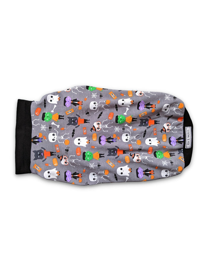 Back view of the monster squad Halloween Dog Muscle Tank by Jax & Molly's, featuring a playful print of iconic monsters like Dracula and Frankensteins accented with black trim on a white background.