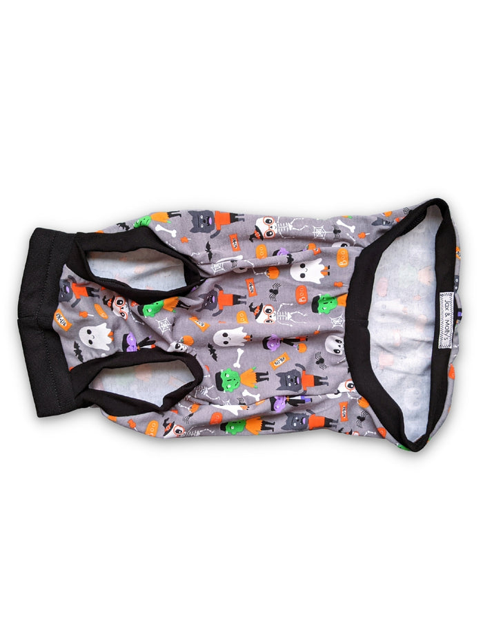 Underbelly View of the monster squad Halloween Dog Muscle Tank by Jax & Molly's, featuring a playful print of iconic monsters like Dracula and Frankensteins accented with black trim on a white background.