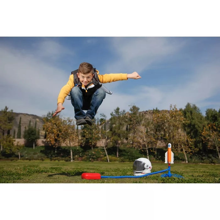 Kid playing outside with NASA Stomp Rockets.