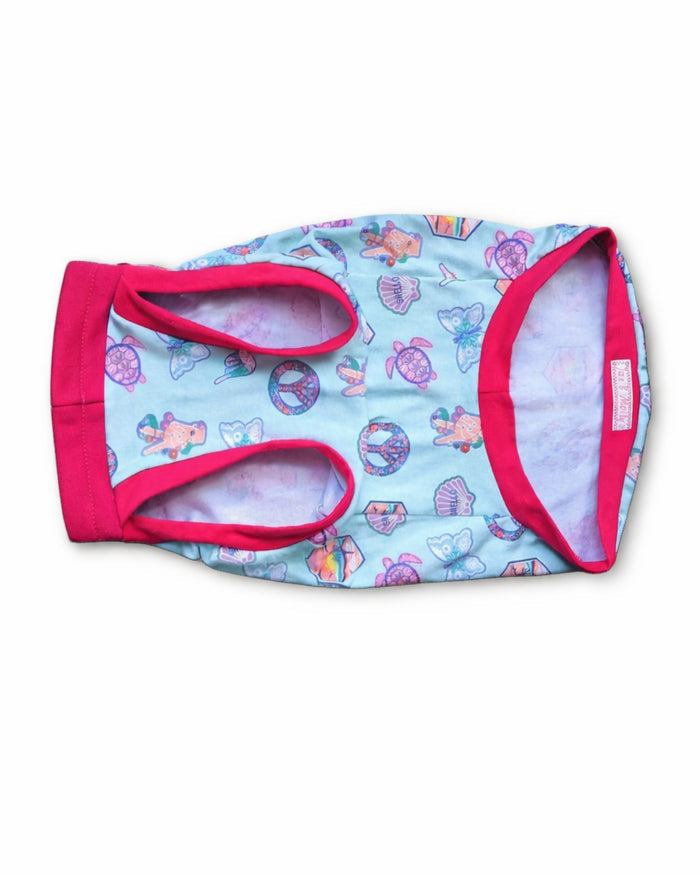 Pastel Ocean Icons cotton-spandex dog pajamas with fuchsia trim, flat underside view
