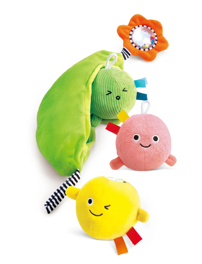 Colorful plush toys with smiling faces on a white background