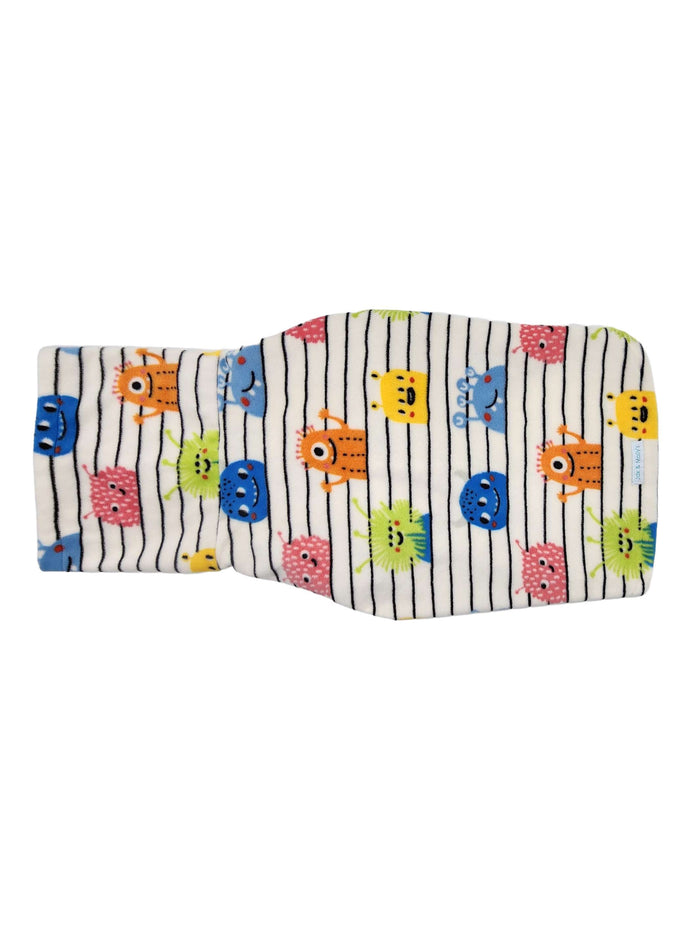 Backside of a fleece dog sweater with a colorful print of monsters