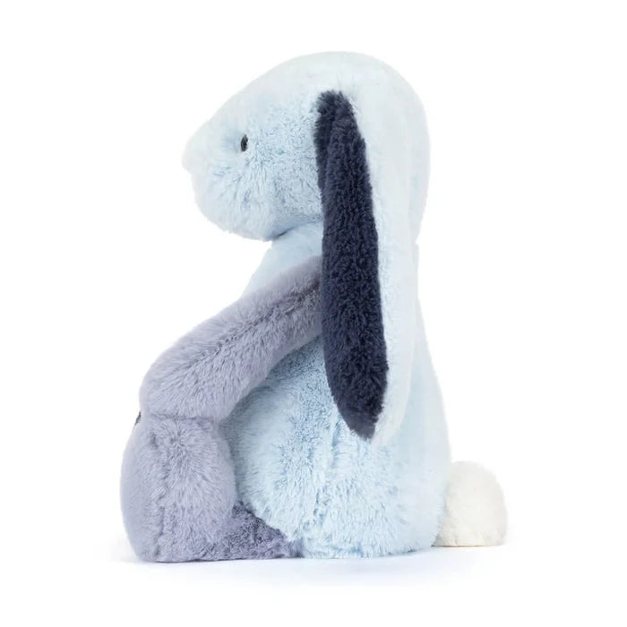 Plush toy rabbit with a white face and dark gray ears on a white background