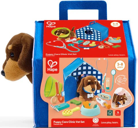 Hape Puppy Care Clinic Vet Set packaging with plush dog toy on a white background