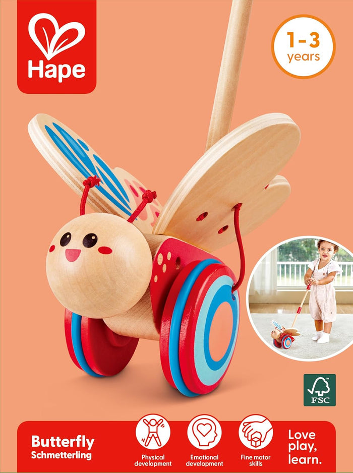 Packaging for the Wooden Butterfly Push Toy with Hape logo and child playing inset on an orange background