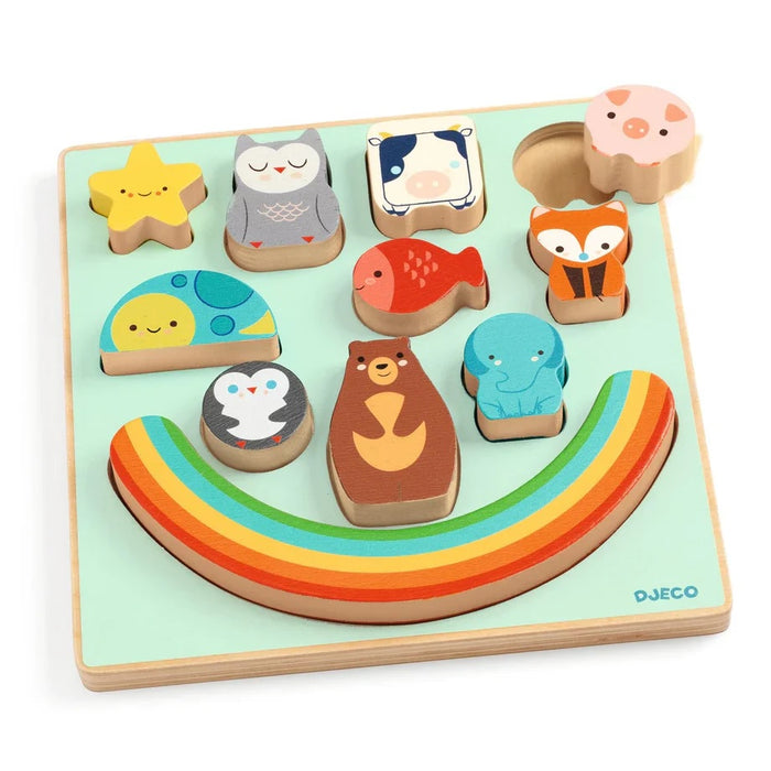Wooden puzzle with animal shapes and a rainbow on a white background