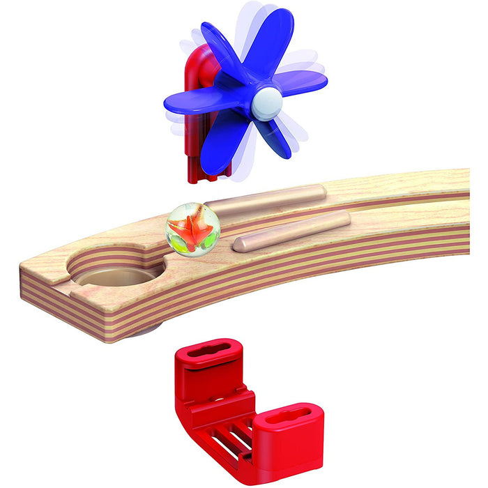 Close up of wooden and plastic set pieces for the Quadrilla Cliffhanger on a white background