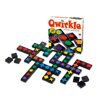Colorful Qwirkle game pieces with box on a white background