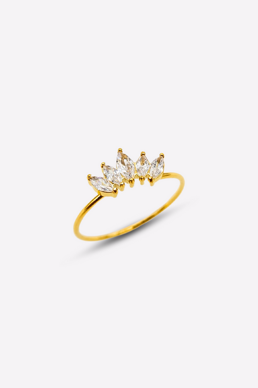 Gold ring with 5 clear gemstones arranged in a crown-like design on a delicate thin 18k PVD gold plated stainless steel band, displayed on a white background.