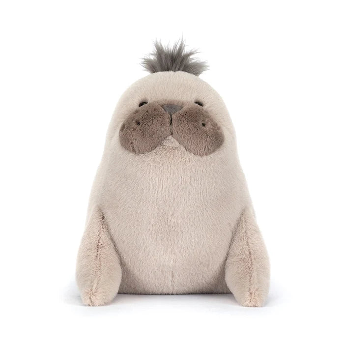 Plush toy otter on a white background