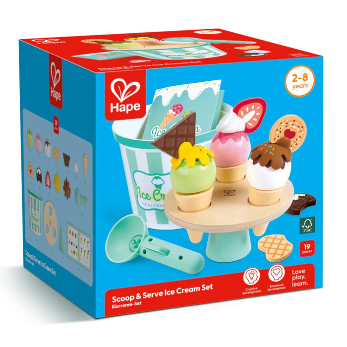 A packaged Scoop & Serve Ice Cream Set by Hape, showing a wooden ice cream bucket, cones, and toppings visible through the transparent window of the box, designed for children's pretend play.