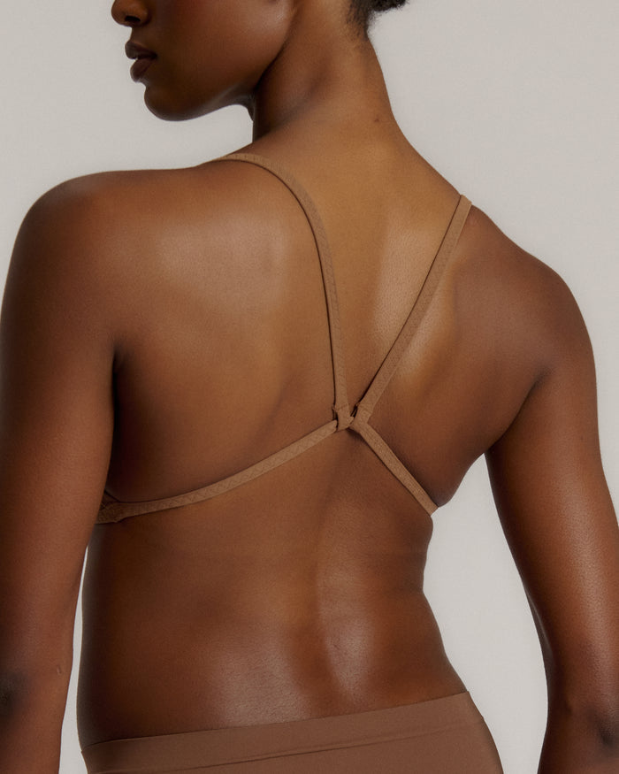 A woman wearing a brownz scoop system and matching bottoms