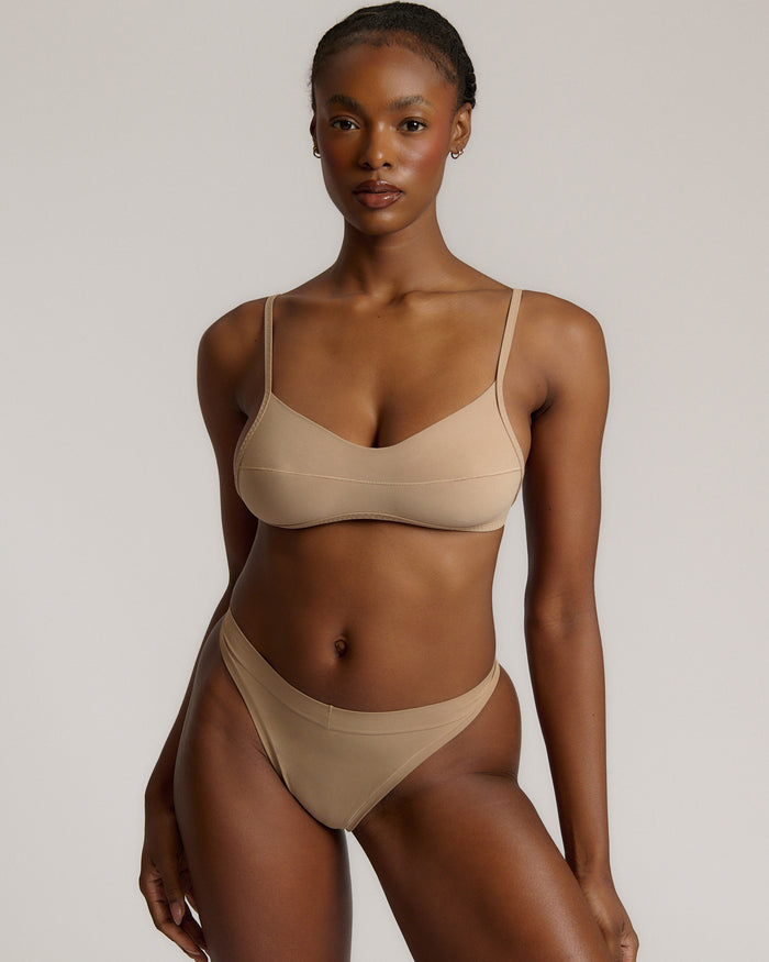 A woman wearing a light scoop system and matching bottoms