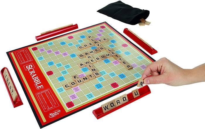 Scrabble game with tiles on board and black bag holder for game tiles