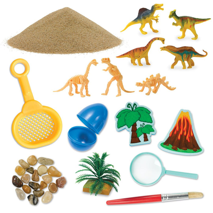 Contents of a dinosaur theme Sensory Bin on a white background