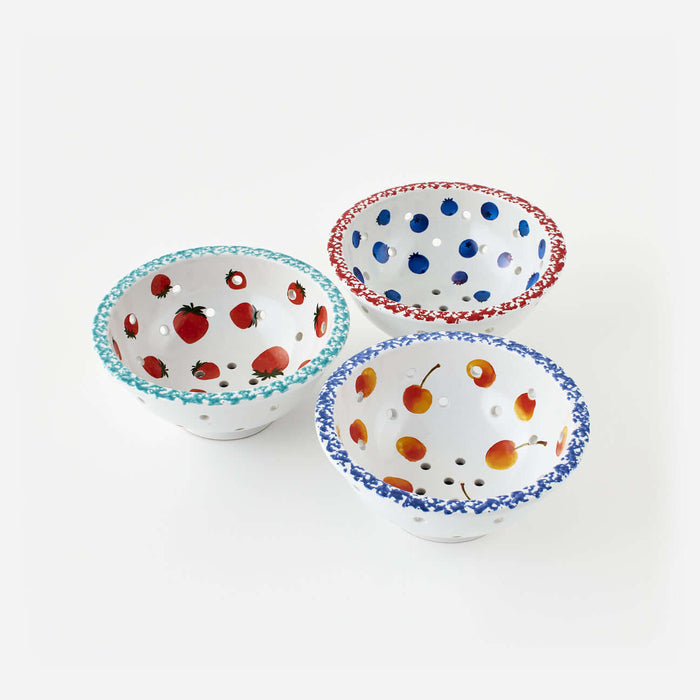 Set of 3 Assorted Berry Bowls with hand-painted fruit designs in various colors and perforated for draining.