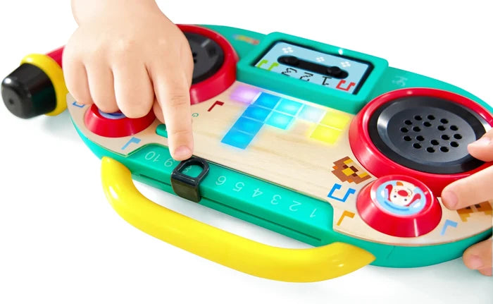 Children's toy boombox with colorful buttons and a digital display on a white background