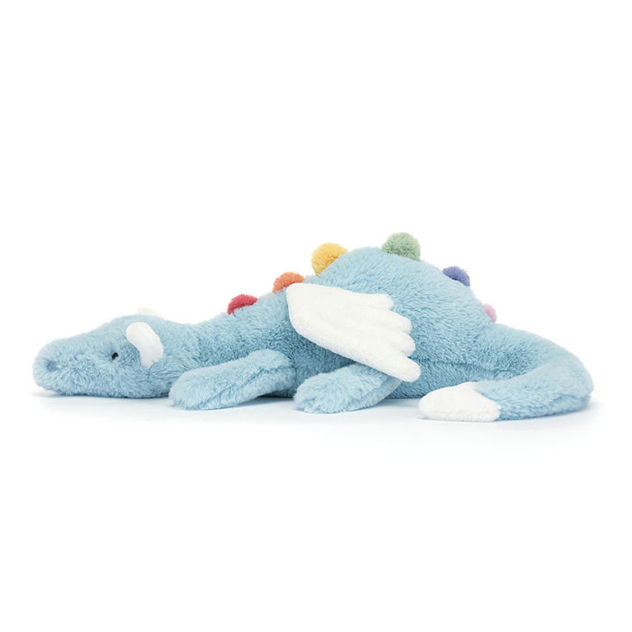 Side view of a blue plush dragon toy with colorful accents on a white background