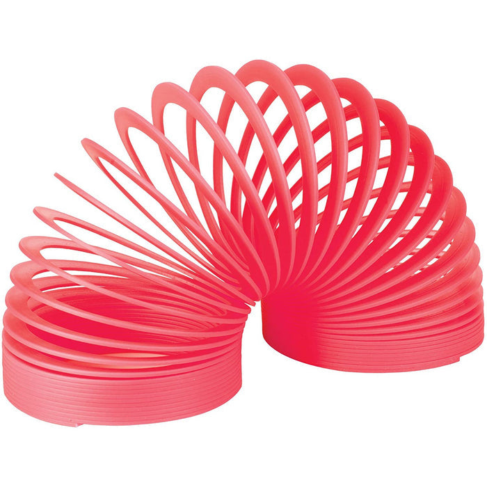 Pink plastic Slinky on a white background