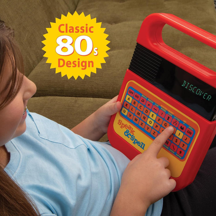 Child playing with a red Spelling & Spell toy, sitting on a brown couch.