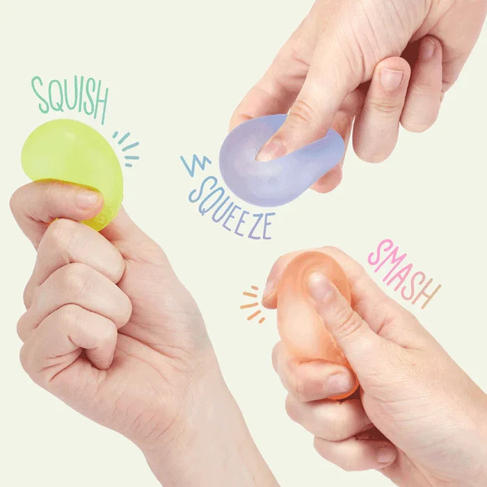 Three colorful stress balls being squeezed by hands with text labels on a light background.