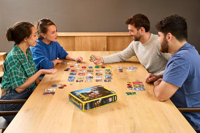 Four people playing Splendor on a wood table