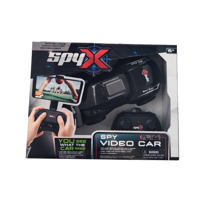 Spy X Video Car toy set in its retail packaging, featuring a black spy headset with a screen, a toy car, and two black controllers shown through a clear window on a white background.