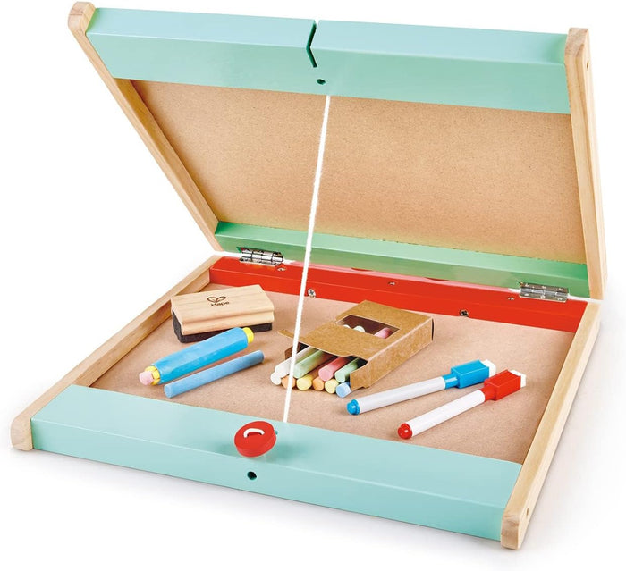 Colorful chalk, dry erase markers, and an eraser stored inside the easel