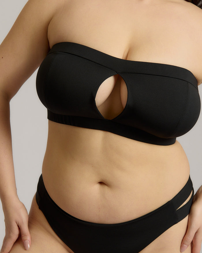 Black strapless bikini worn by a person on a neutral background