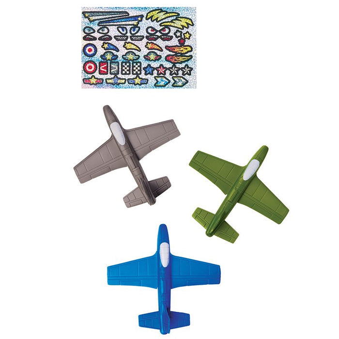 A grey, green, and blue foam flyer and shiny foil stickers on a white background