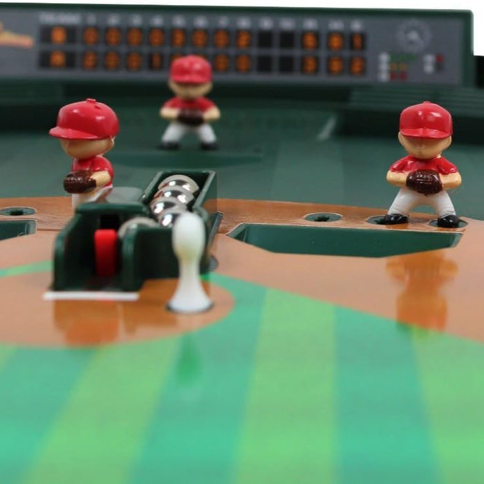 Tabletop baseball game with player figures and scorekeeper.