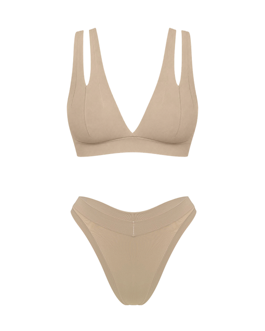 Matching two piece beige underwear set, bra with v plunge and double shoulder strap detail.