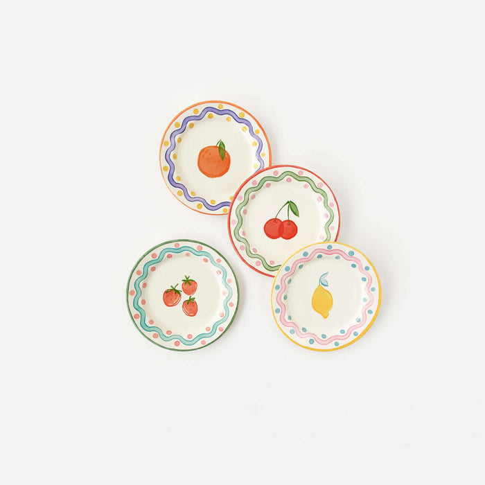 Terrazzo "Enamel" Fruit Plate, Set of 4 in colorful designs featuring fruits like orange, cherries, strawberries, and lemon.