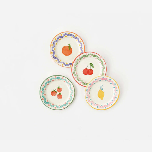 Terrazzo "Enamel" Fruit Plate, Set of 4 in colorful designs featuring fruits like orange, cherries, strawberries, and lemon.