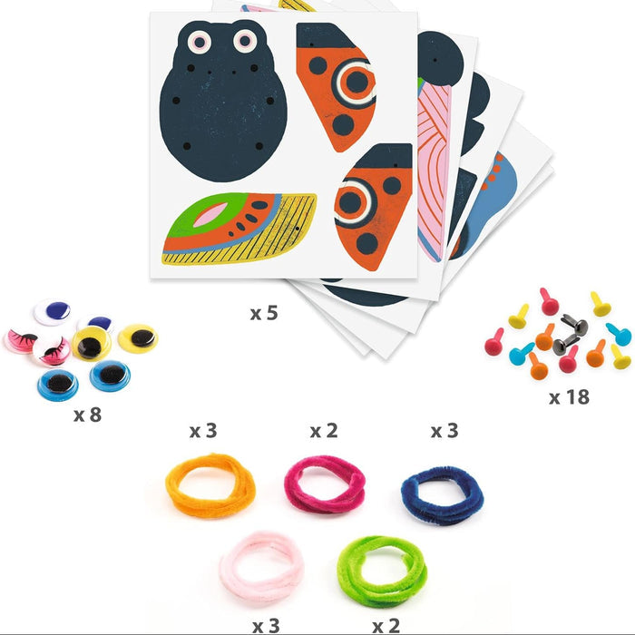 Set of craft supplies including stickers, googly eyes, and hair ties on a white background