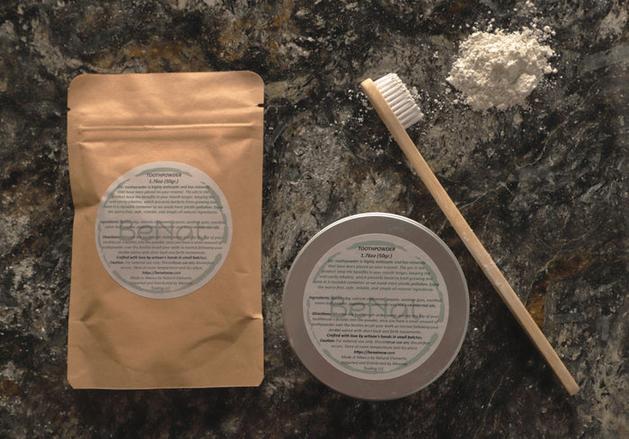Complete plastic-free oral hygiene toothpowder bundle set for daily dental care on a marble surface