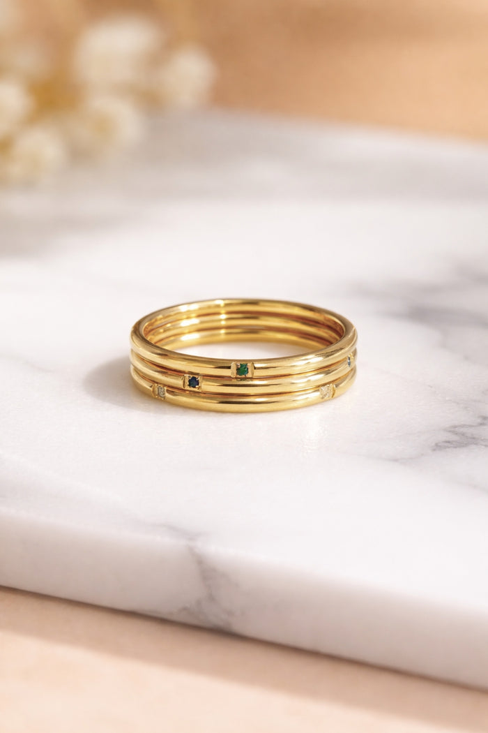 tri color gemstone gold stacking rings 18k pvd stainless steel stacked flat front view marble surface