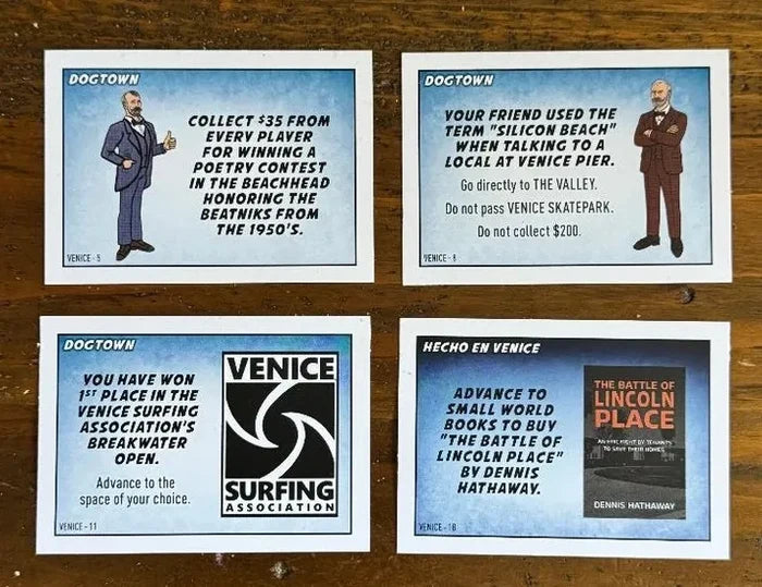 Four vintage-style cards featuring text and graphics on a wooden surface