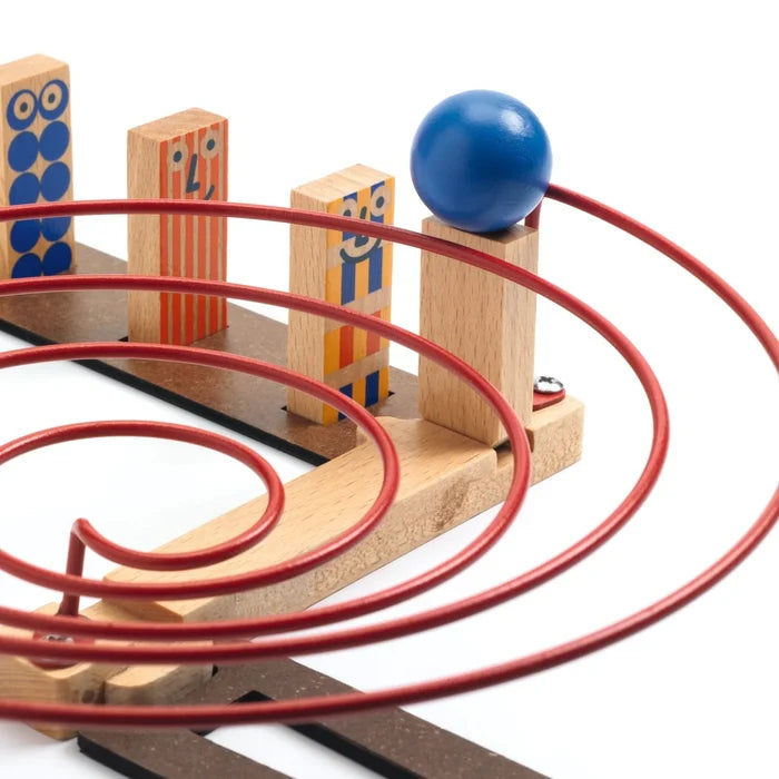 Wooden ball track with red tracks and a blue ball on a white background